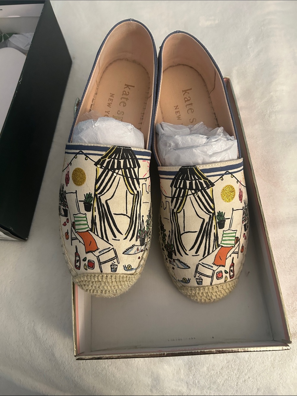 kate spade cream canvas espadrilles with navy trim and colorful illustration